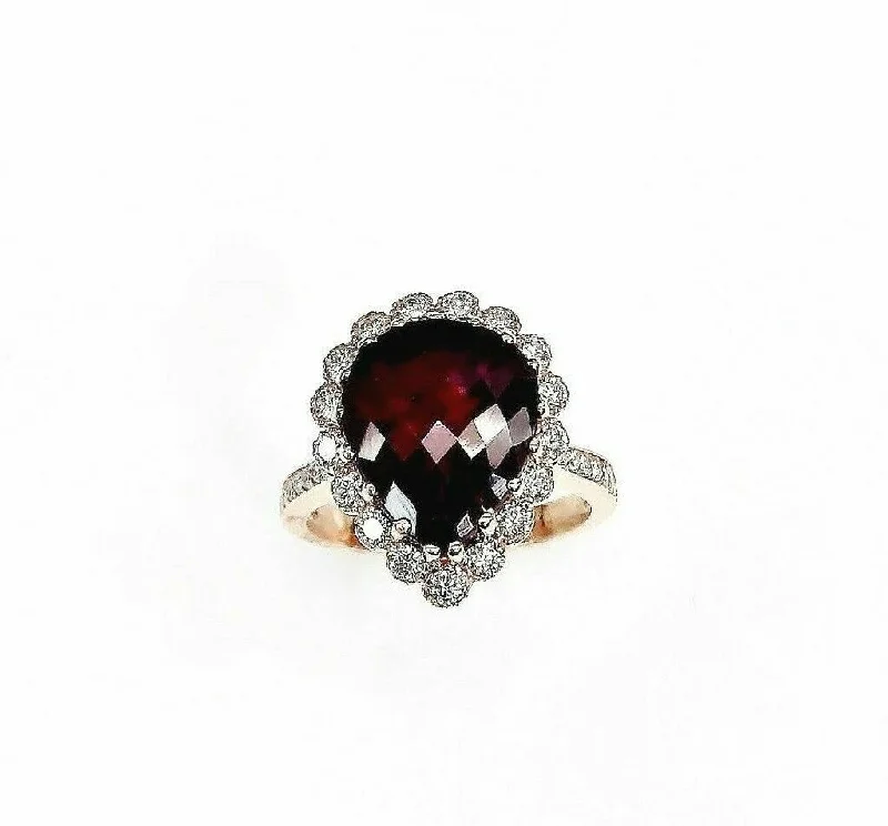 Platinum Engagement Rings6.49 Carats t.w. Diamond and Ruby Halo Ring Ruby is 5.48 Carats 14K Rose Gold