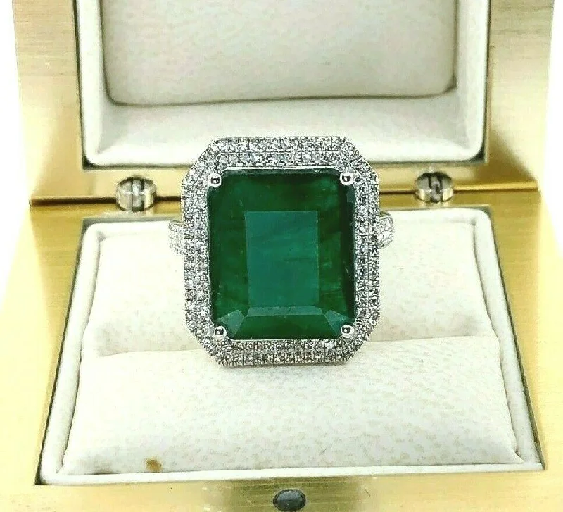 Marquise Cut Engagement Rings8.77 Carats t.w. Diamond and Emerald Halo Pave Set Ring Emerald is 8.32 Carats