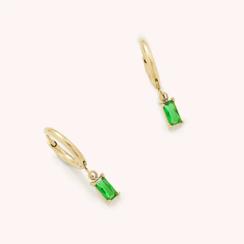 Gold hoop earrings adding sunny shine to ears -Eden Emerald Gem Huggies