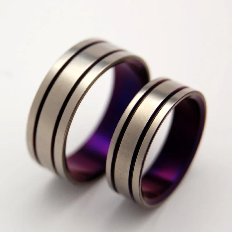 Sharp rings with sleek cuts for contemporary style -Alma Mater | Purple Titanium Wedding Ring