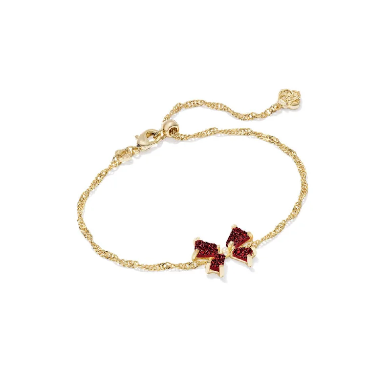 Vintage gold bangles with intricate patterns and detailing for a timeless style -Kendra Scott Blair Bow Small Delicate Chain Bracelet