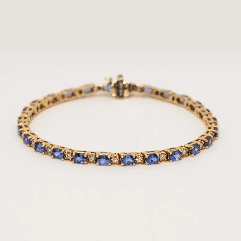 Statement bangle bracelets with oversized gemstones for a dramatic, fashionable look -Oval Tanzanite Bracelet in 14kt Yellow Gold with Diamonds (1/2ct tw)