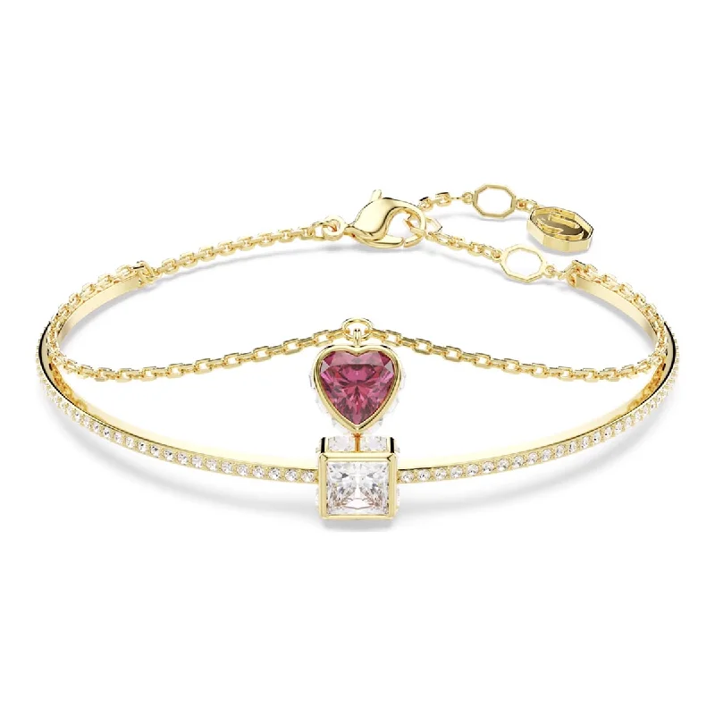 Fashionable stacked bracelets for a layered look with a mix of metals -Swarovski Chroma Pink Heart Bangle Bracelet